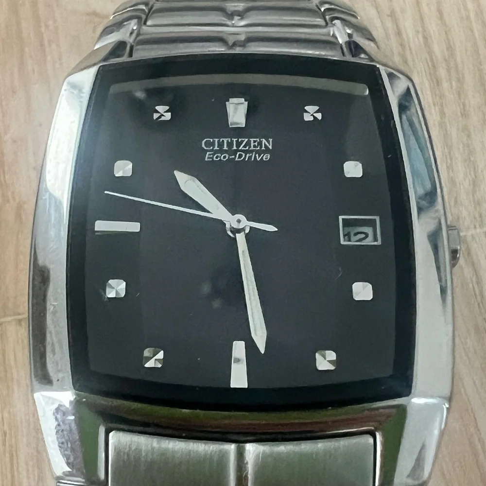 Citizen eco-drive rectangular black dial silver tone solar dress watch